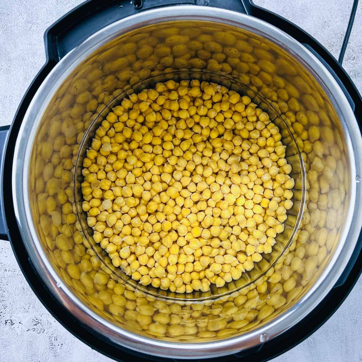 Soaked chickpea and water in Instant Pot.