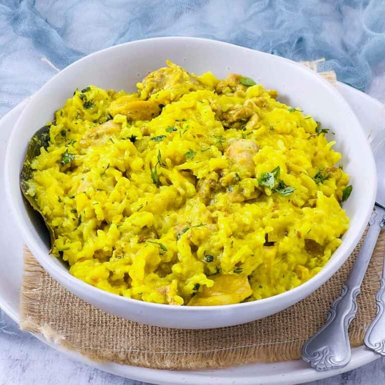 Chicken khichdi in a white bowl.