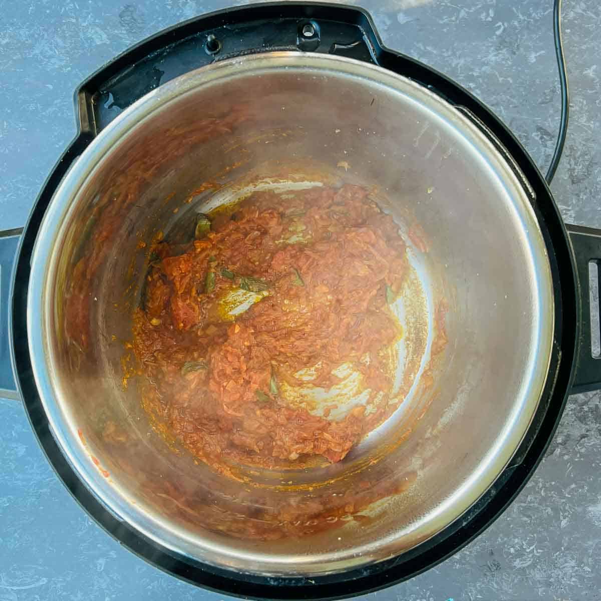 Cooked tomatoes and spices in the Instant Pot.