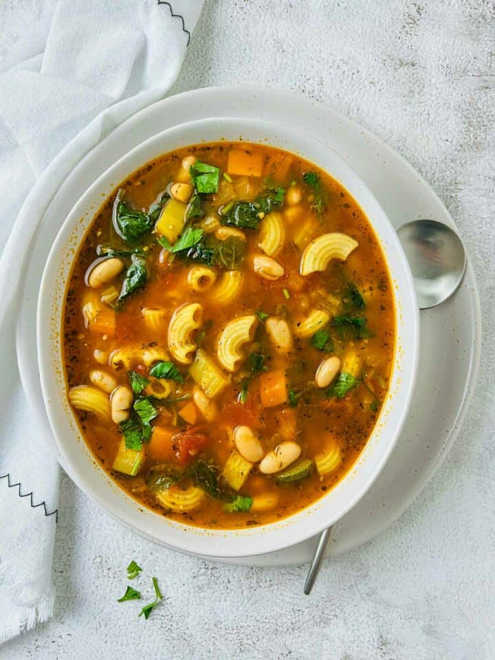 Instant Pot minestrone soup in a white bowl.