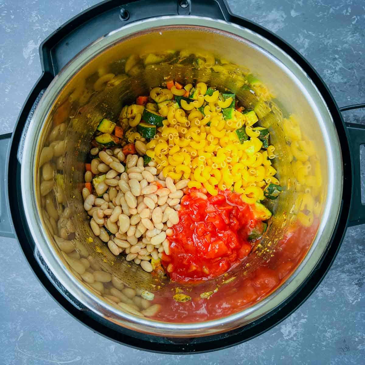 Beans, pasta, and tomatoes in the Instant Pot.