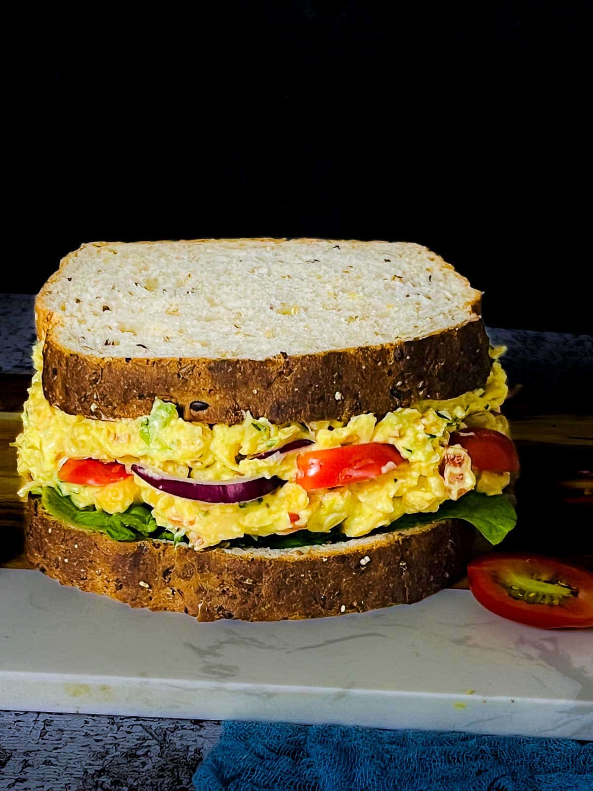 Assembled sandwich covered with top bread.