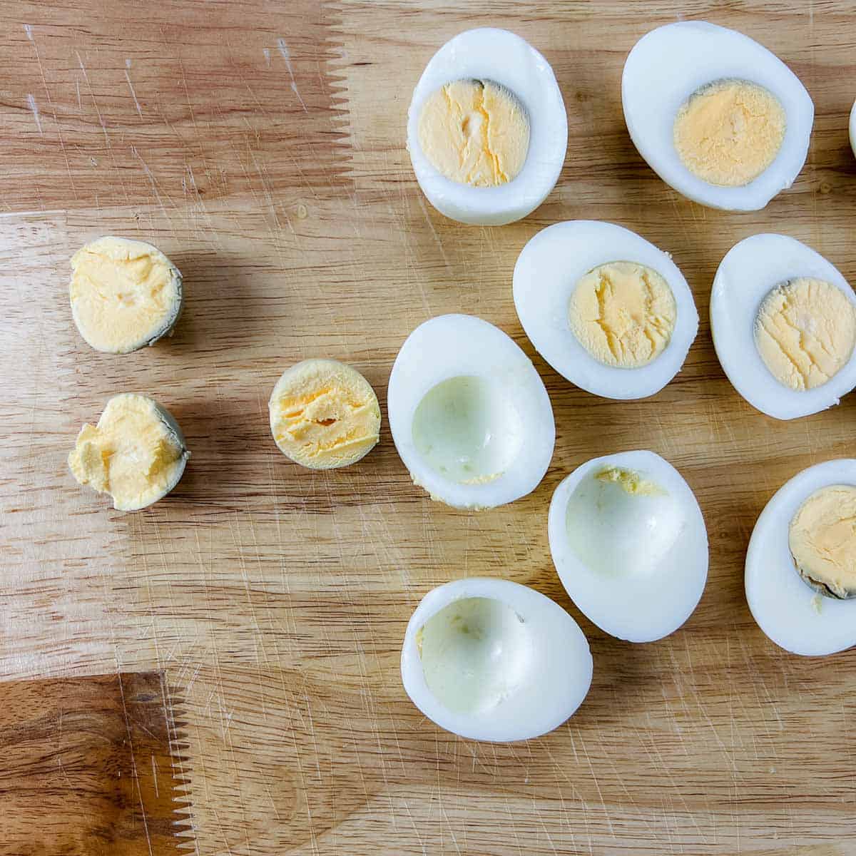 Egg yolks scooped out of the whites from hard-boiled eggs.