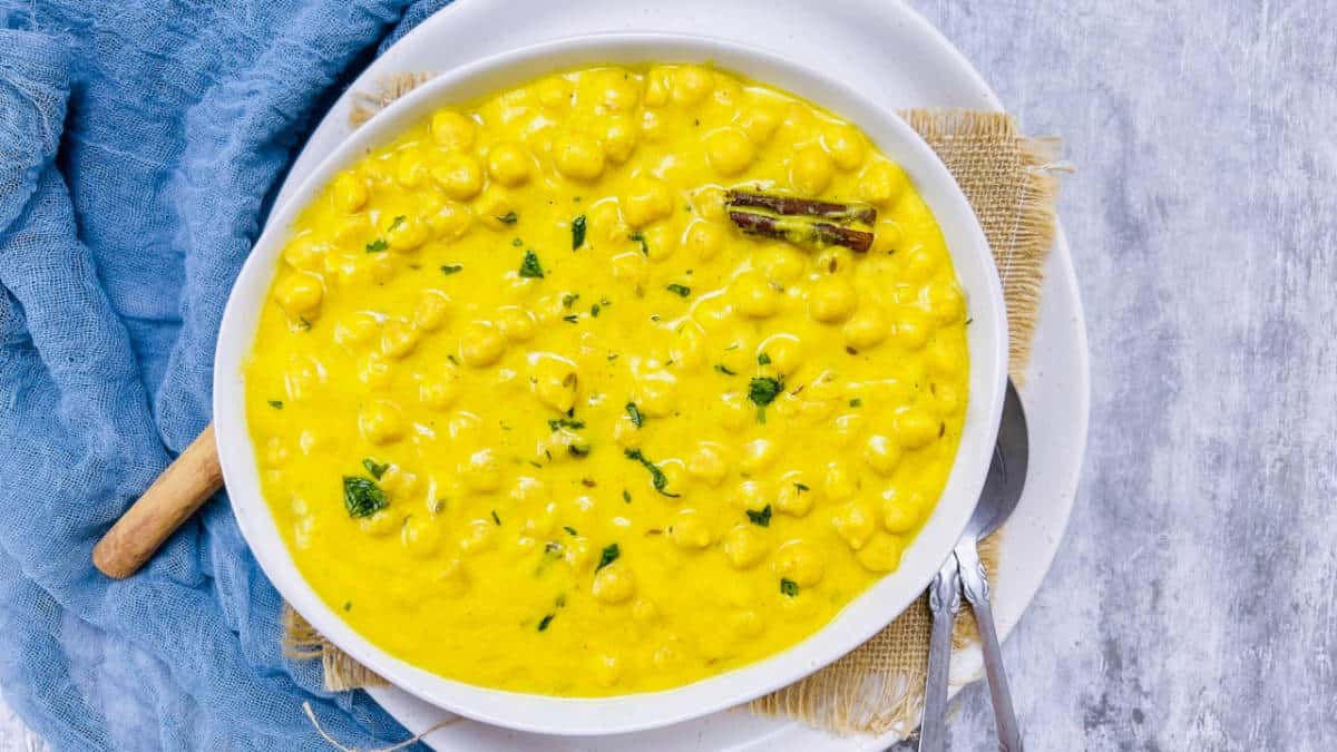 Chana madra in a white bowl.