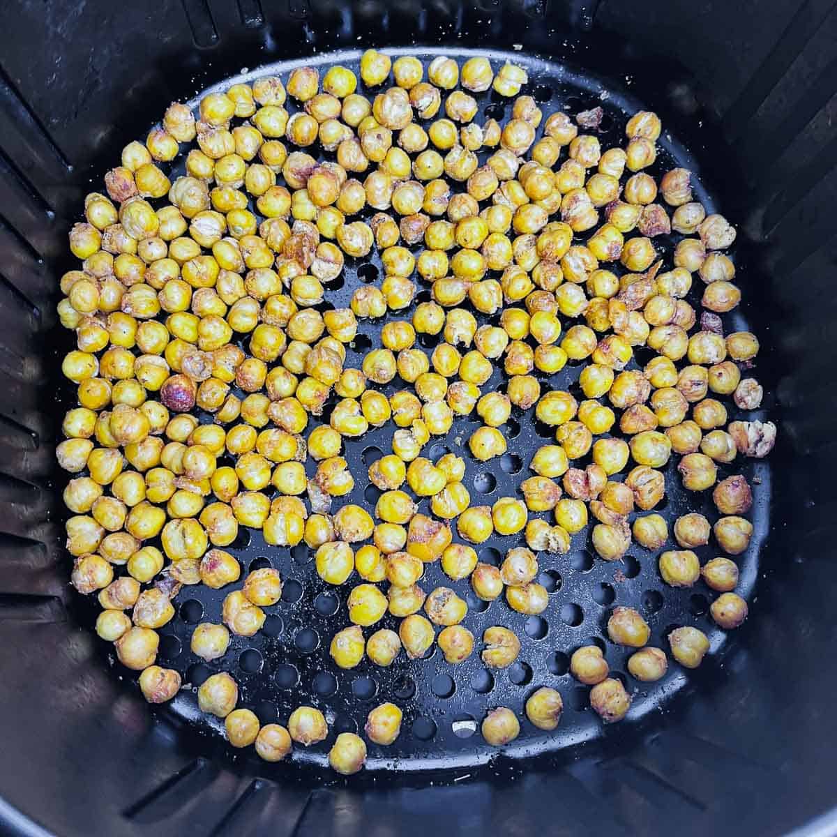Cooked chickpeas seasoned and roasted in the air fryer.