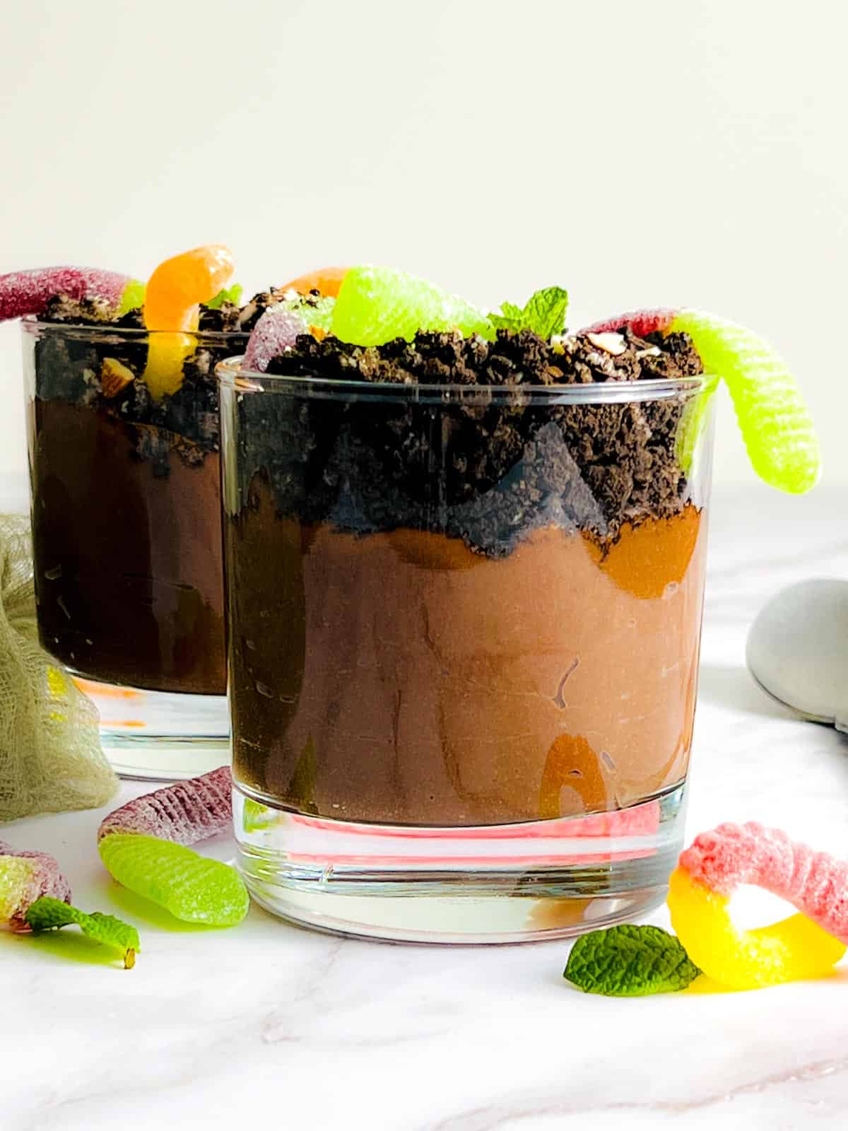 Chocolate dirt pudding in two small glasses.