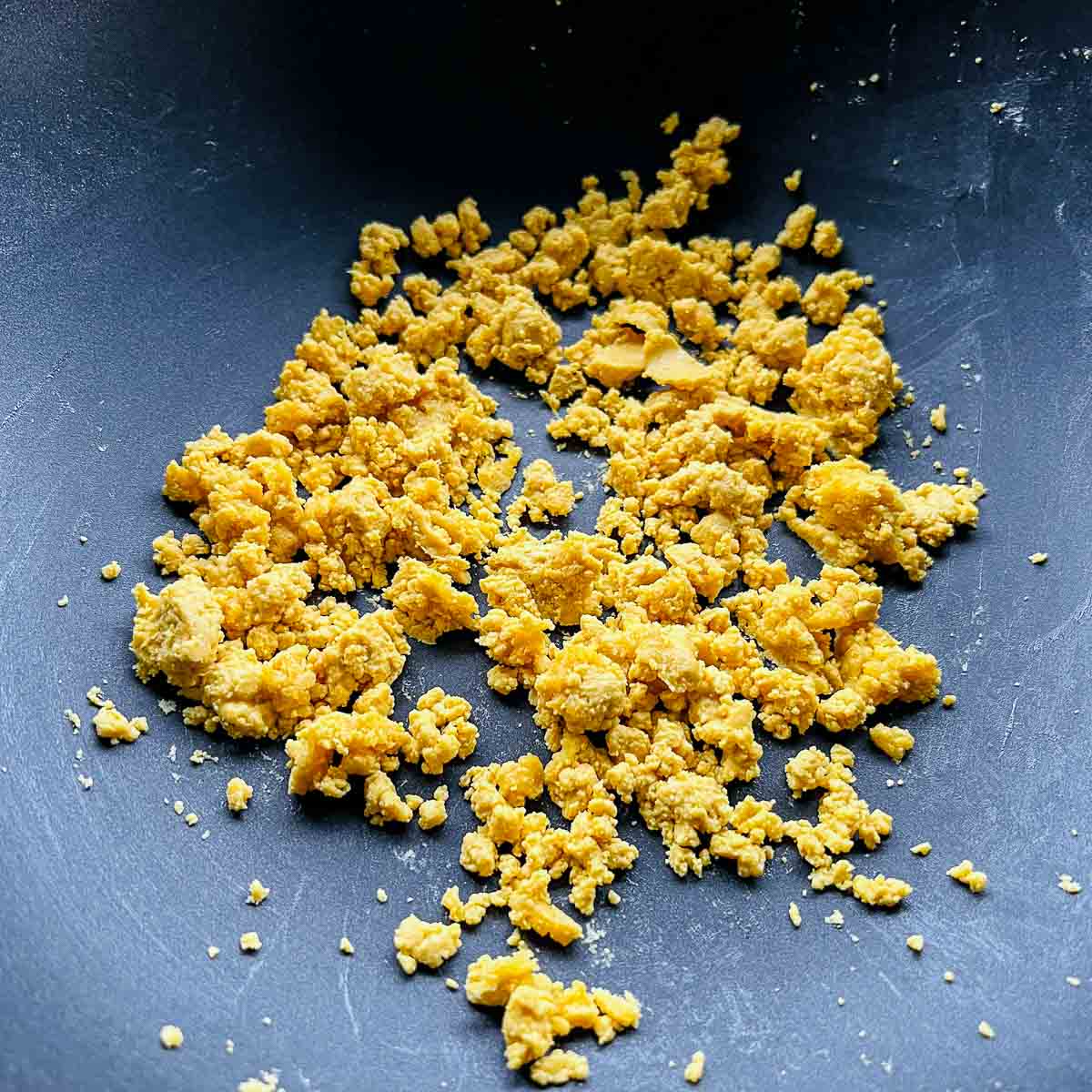 Roasted chickpea flour in frying pan.