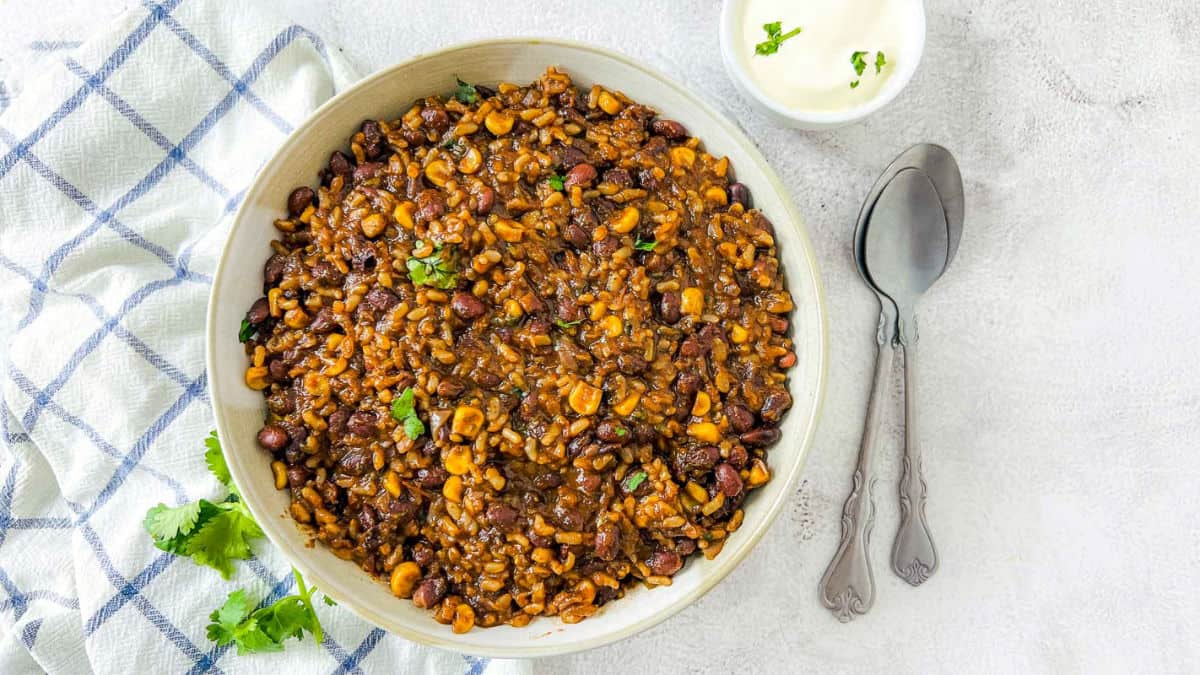 Mexican rice and beans served with sour cream.