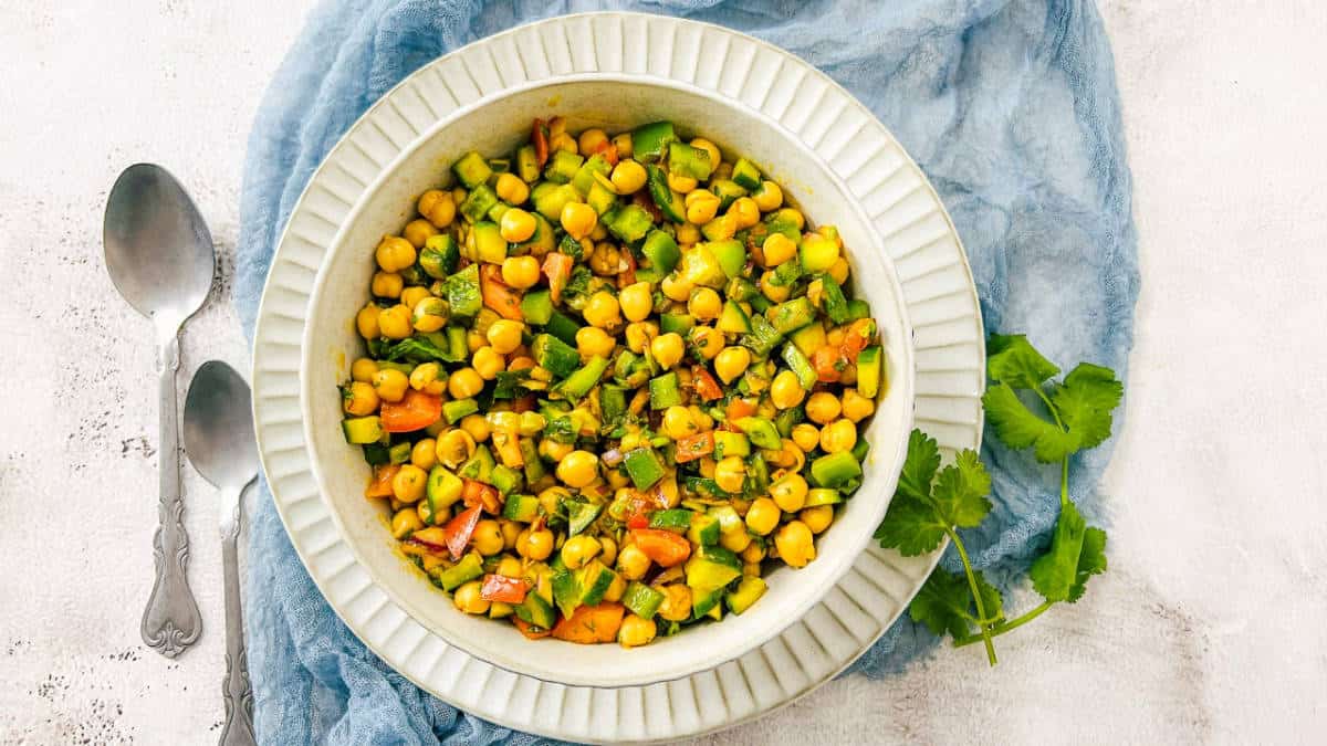 Moroccan chickpea salad in a white bowl.