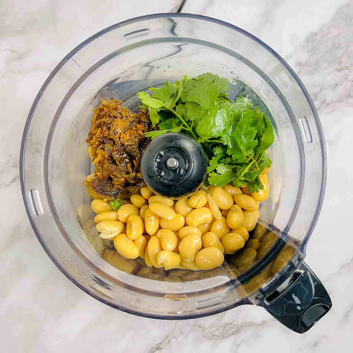 Onion mixture, beans, and cilantro in food processor.