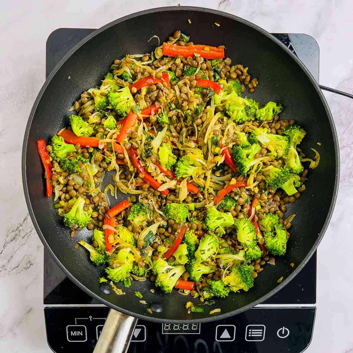 Lentils tossed with broccoli and veggies.