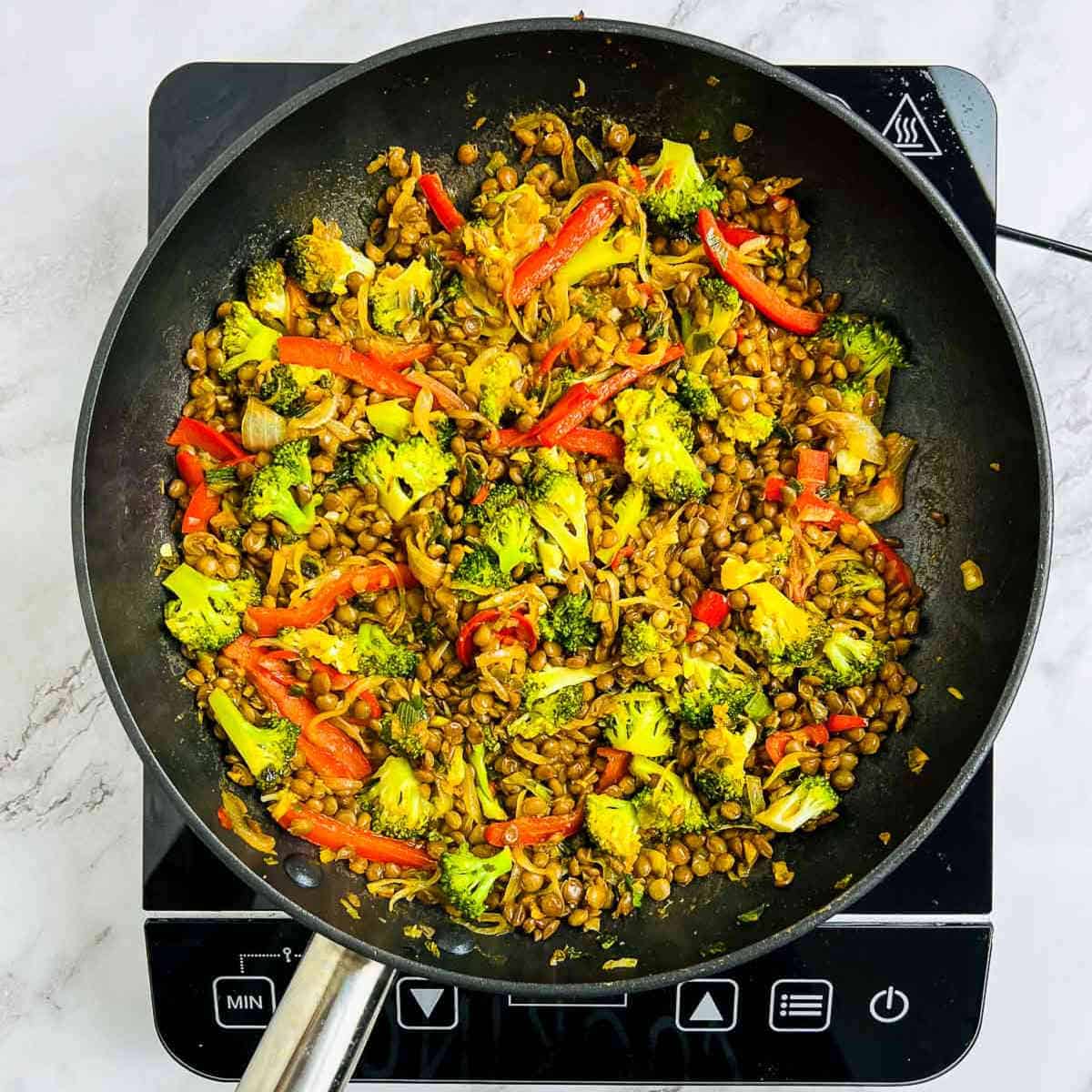 Stir fry sauce added to the frying pan.