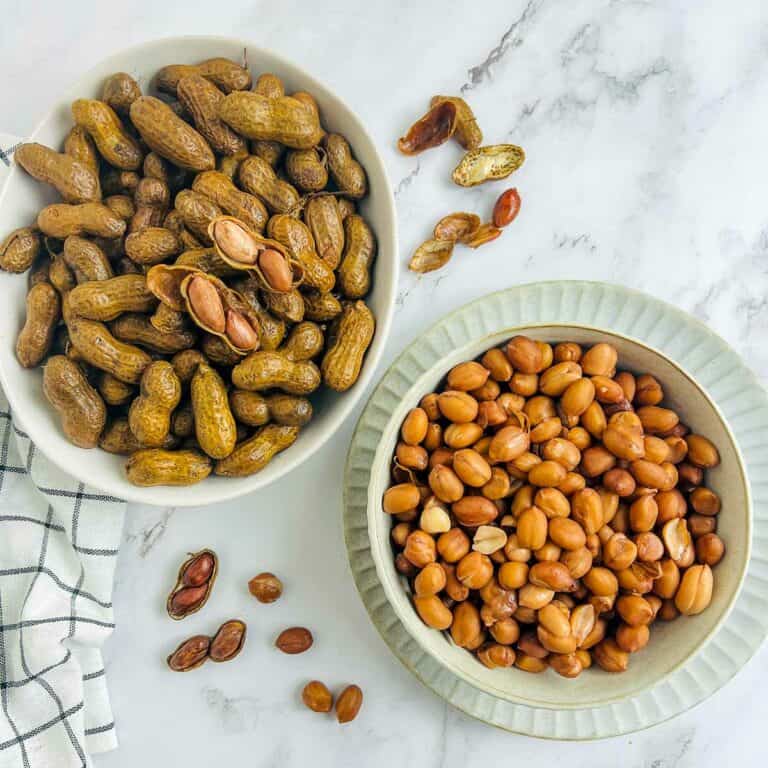 Boiled peanuts in white bowls.