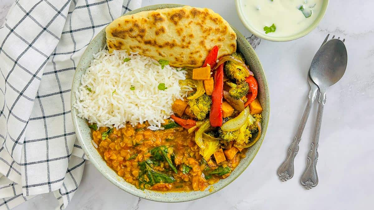 Red lentil dal Buddha bowl with 2-ingredient naan social media image.