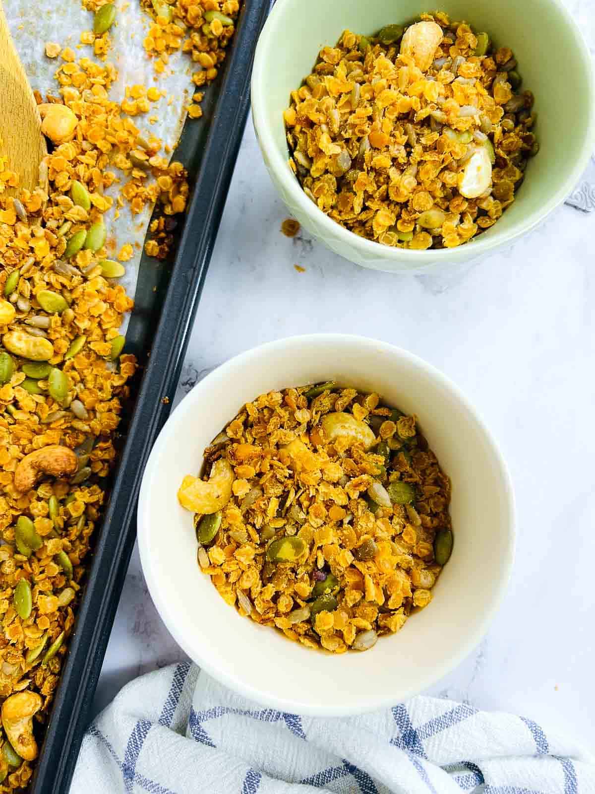 Red lentil granola served in small bowls.