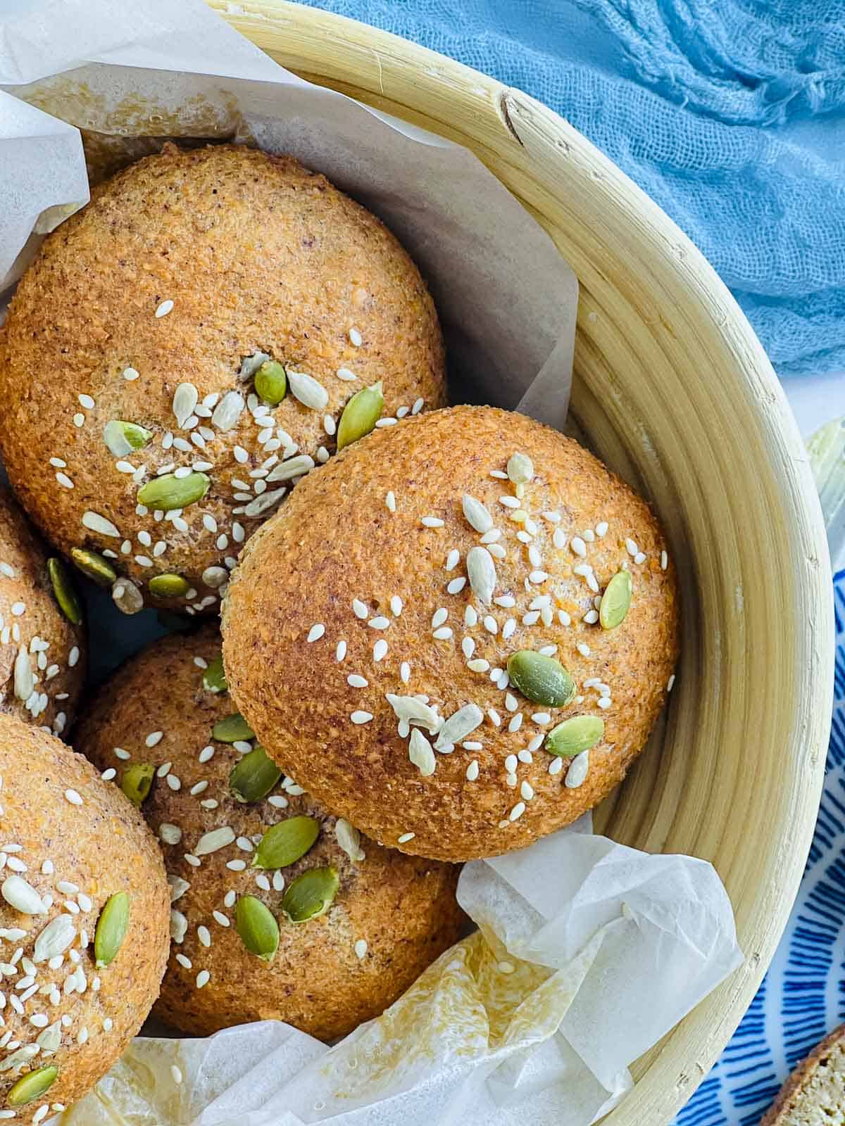 Close up of lentil bread rolls placed in a bread basket.