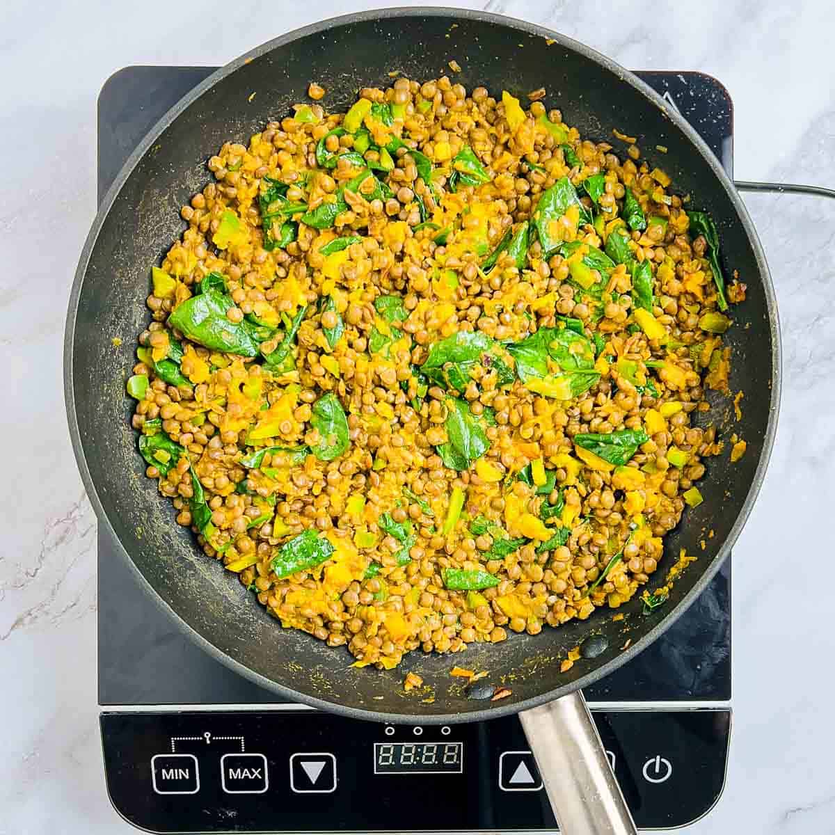 Lentils and spinach cooked with onion-tomatoes.