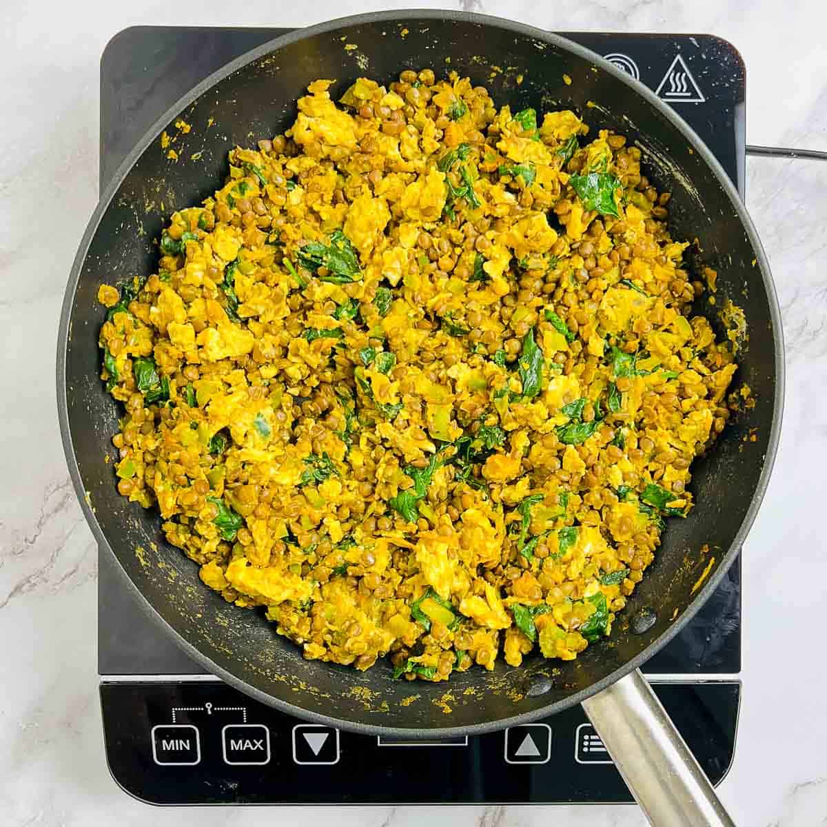 Scrambled eggs tossed with the lentil mixture.