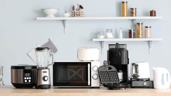 Various kitchen appliances kept on a kitchen counter.