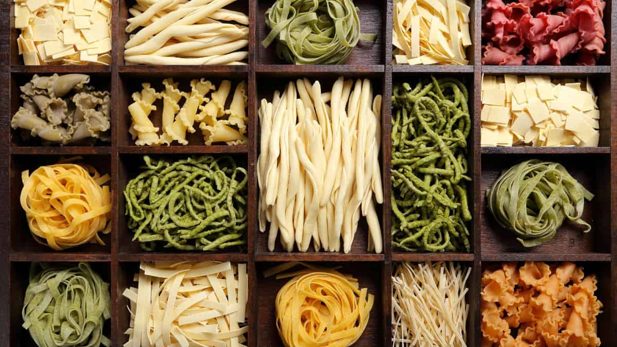 Various types on pasta on a board.