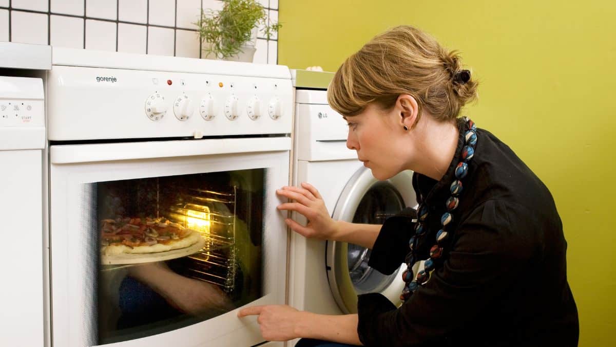 Person watching a bake in the oven.