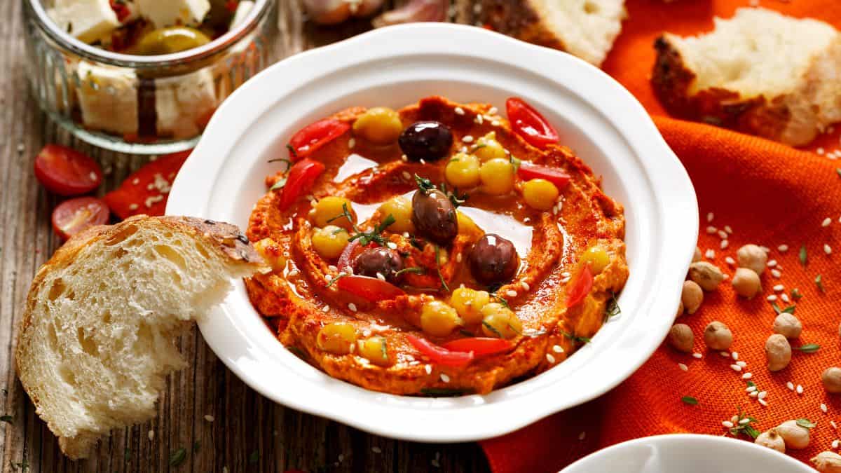 Sun-dried tomatoes hummus in a white bowl.