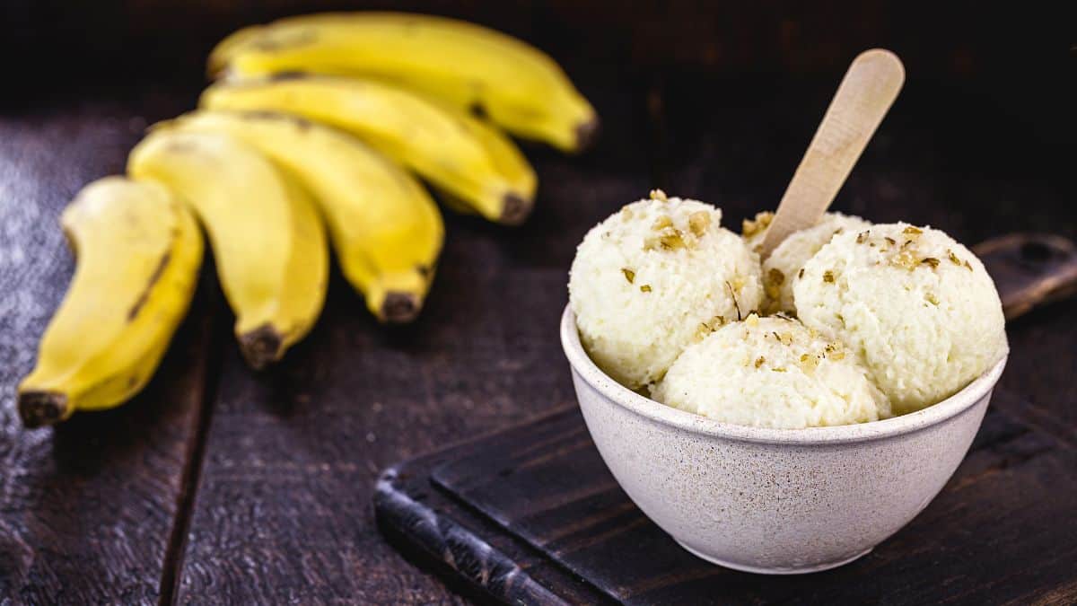 Banana ice cream in a white bowl.