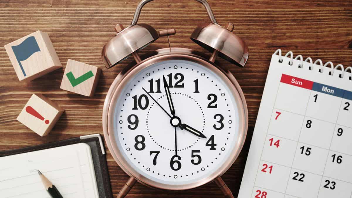 Clock on a brown table.