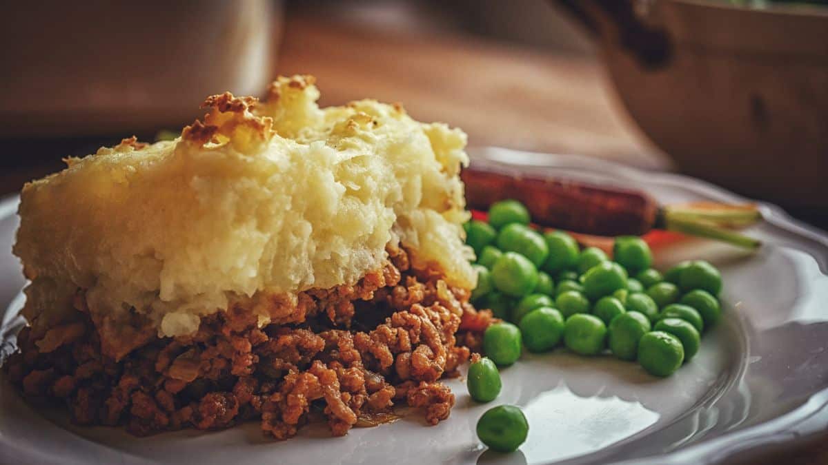 A slice of shepard's pie on a plate.