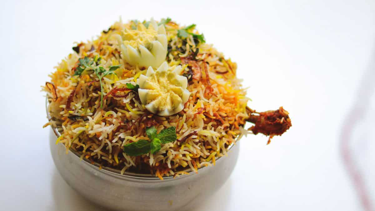 Dindigul egg biryani in a white bowl.