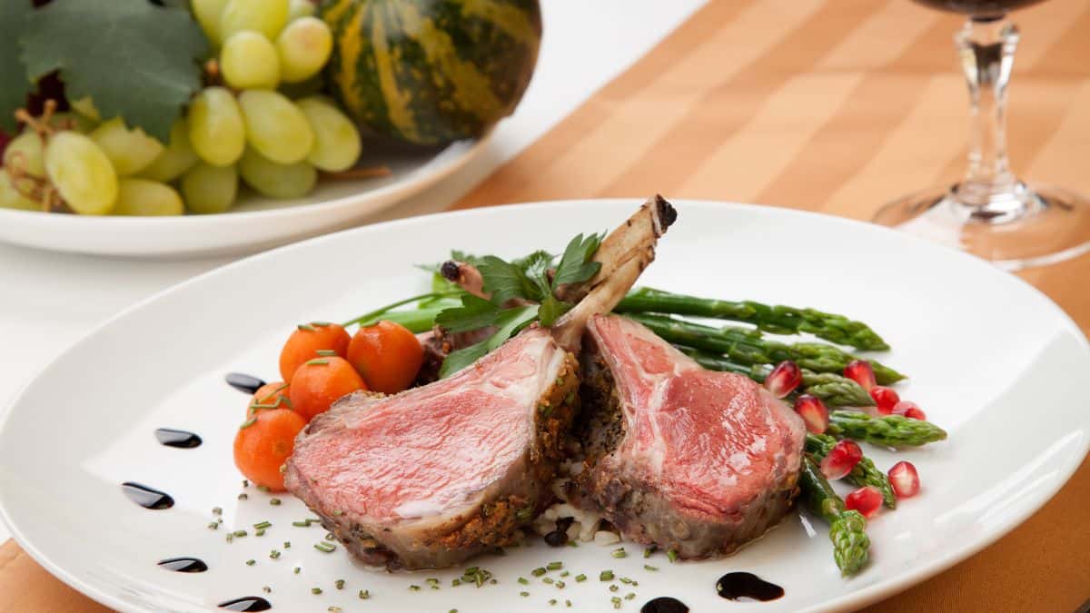 Cooked meat on a white plate.