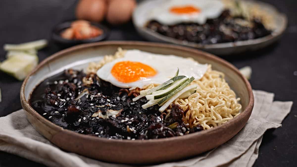 Jajangmyeon noodles topped with fried egg.