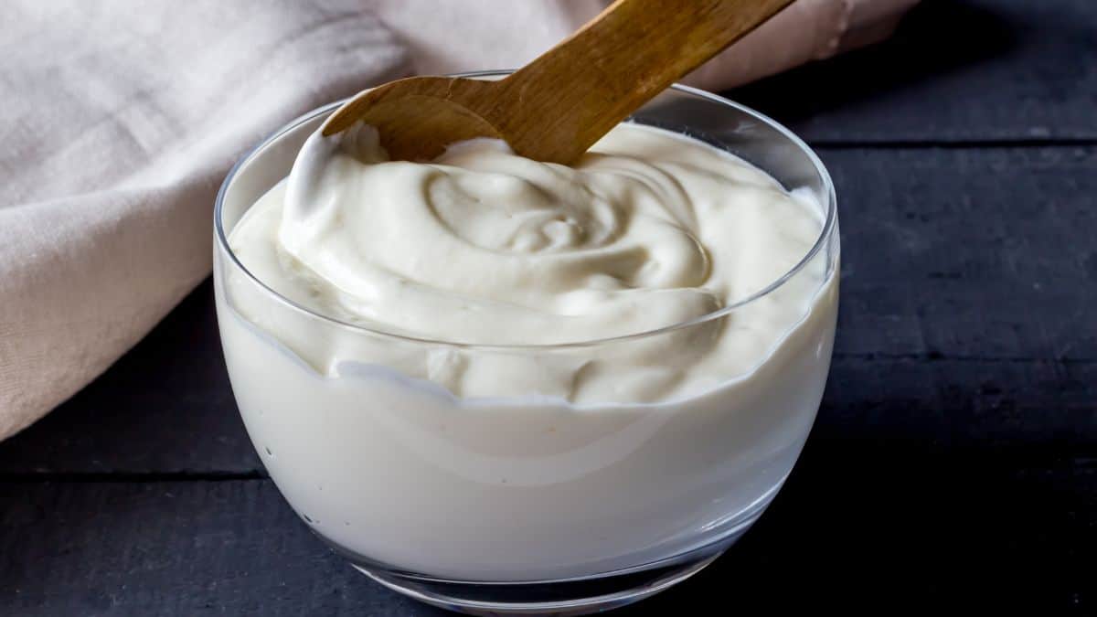 Mayonnaise placed in a glass bowl.