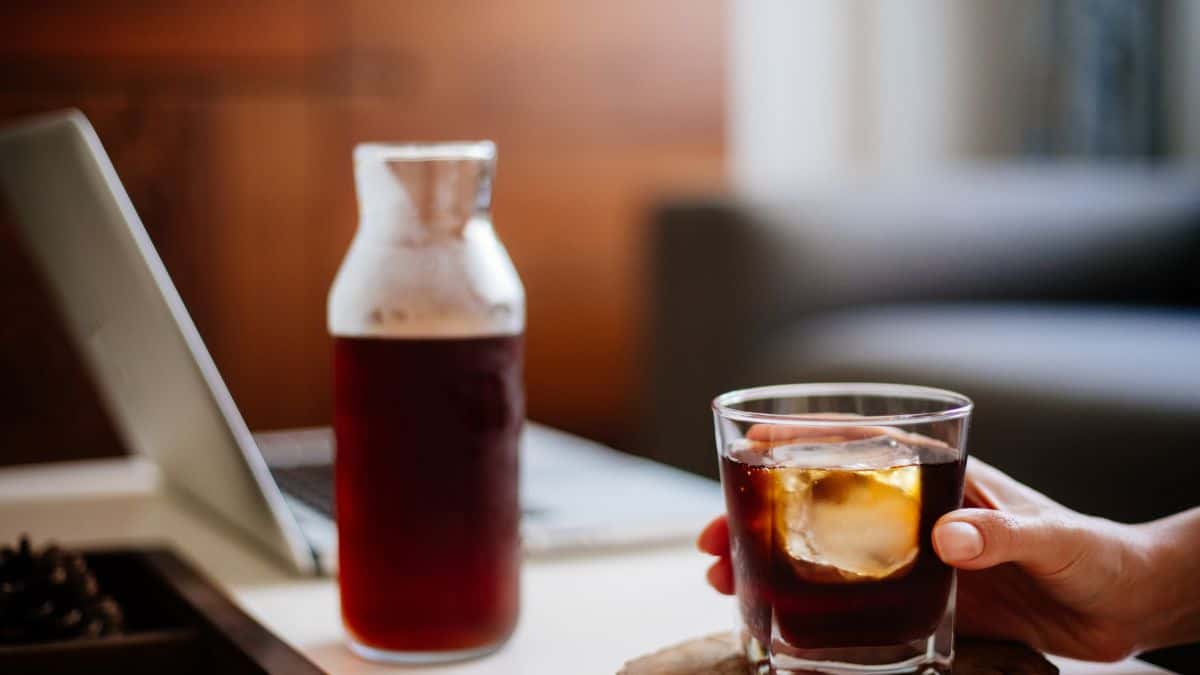 A cup of cold brew with a bottle.