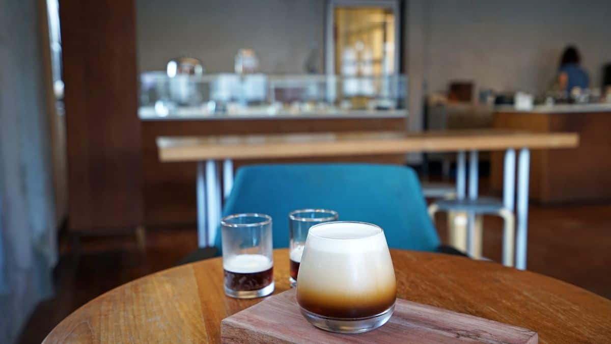 Nitro coffee cup on a kitchen table.