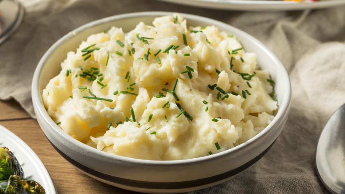 Mashed potatoes in a white bowl.