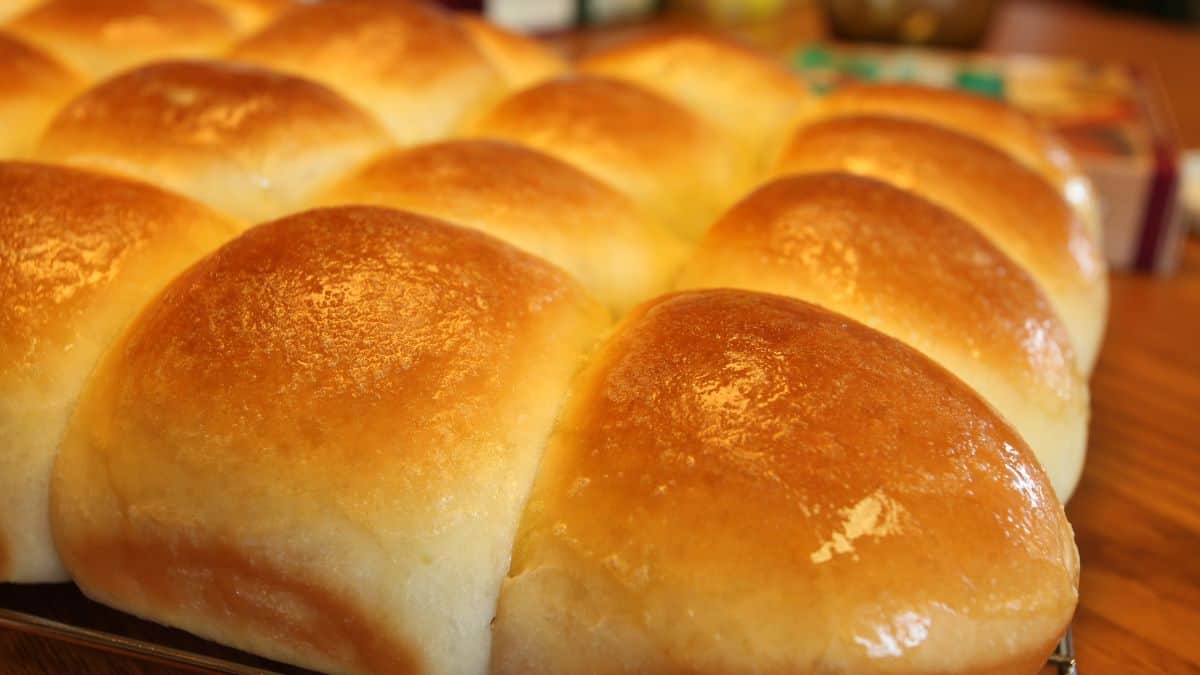 Dinner rolls brushed with butter.