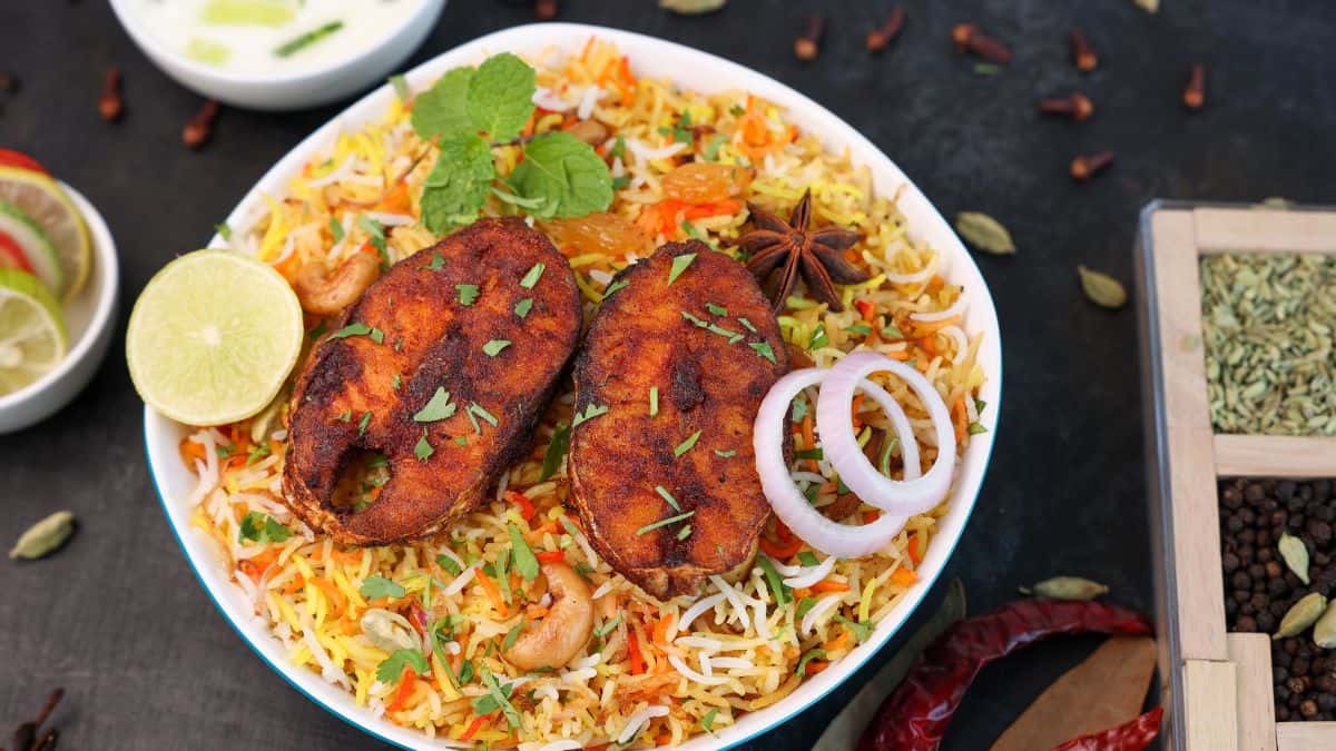 Fish biryani on a white plate.