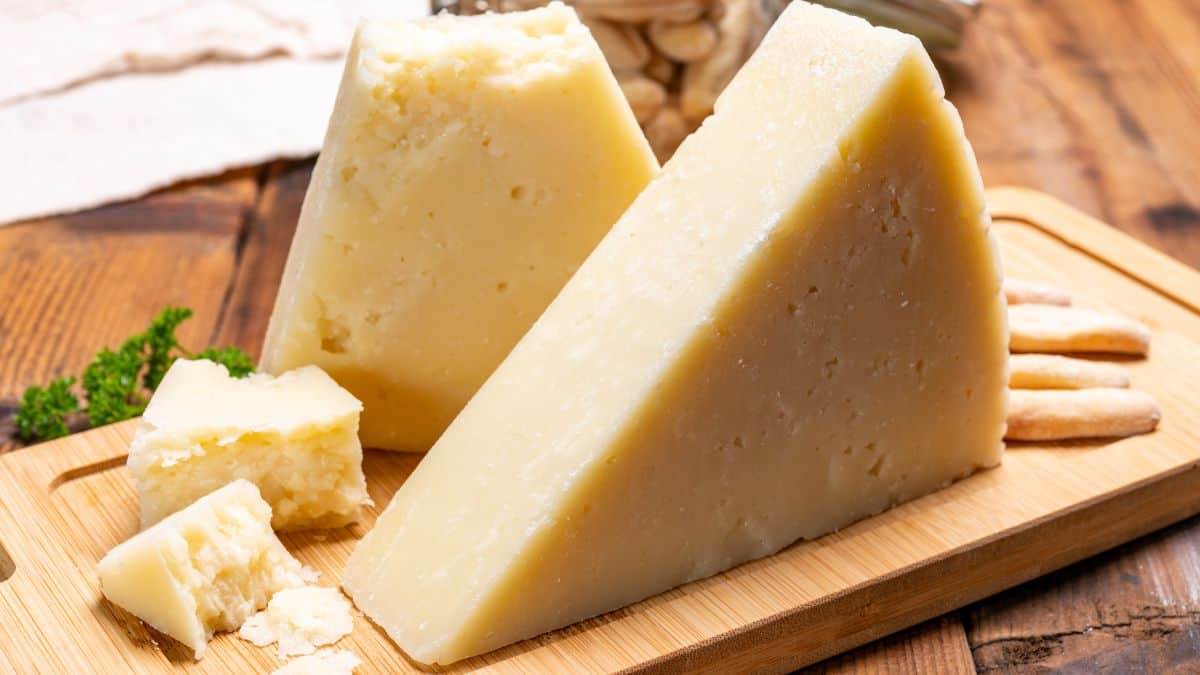 A block of percorino romano on a wooden board.