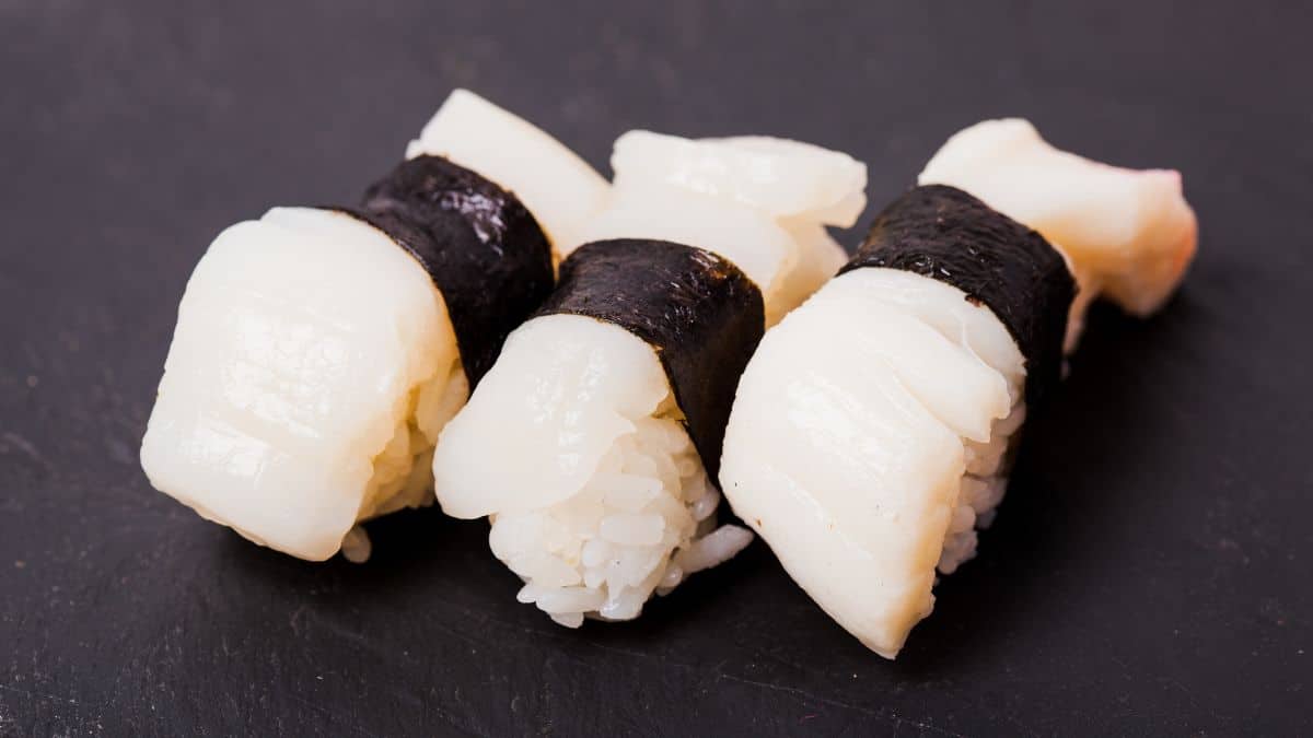 Hotate nigiri or scallop suchi on a plate.