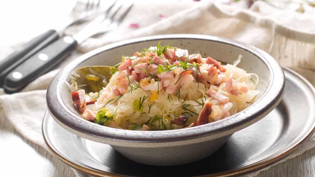 Bacon sauerkraut in a white bowl.