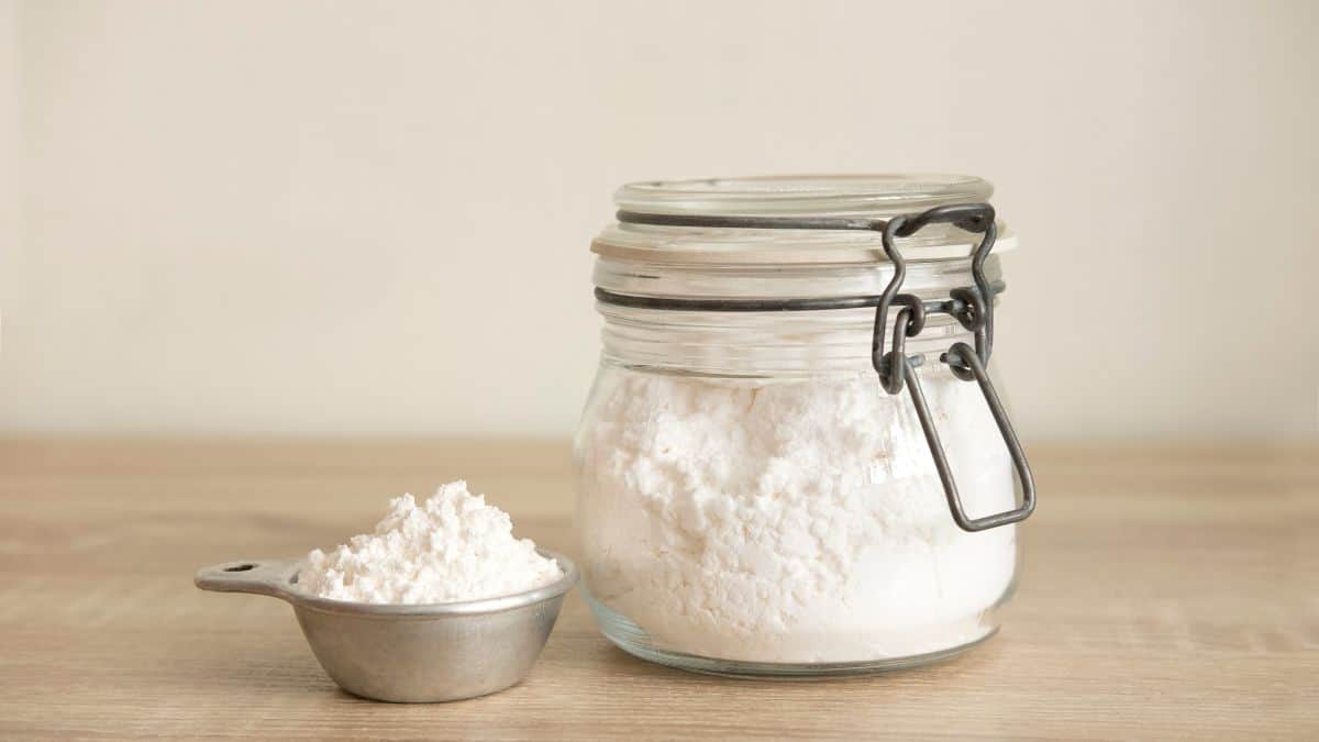 Flour in jar and measuring cup.