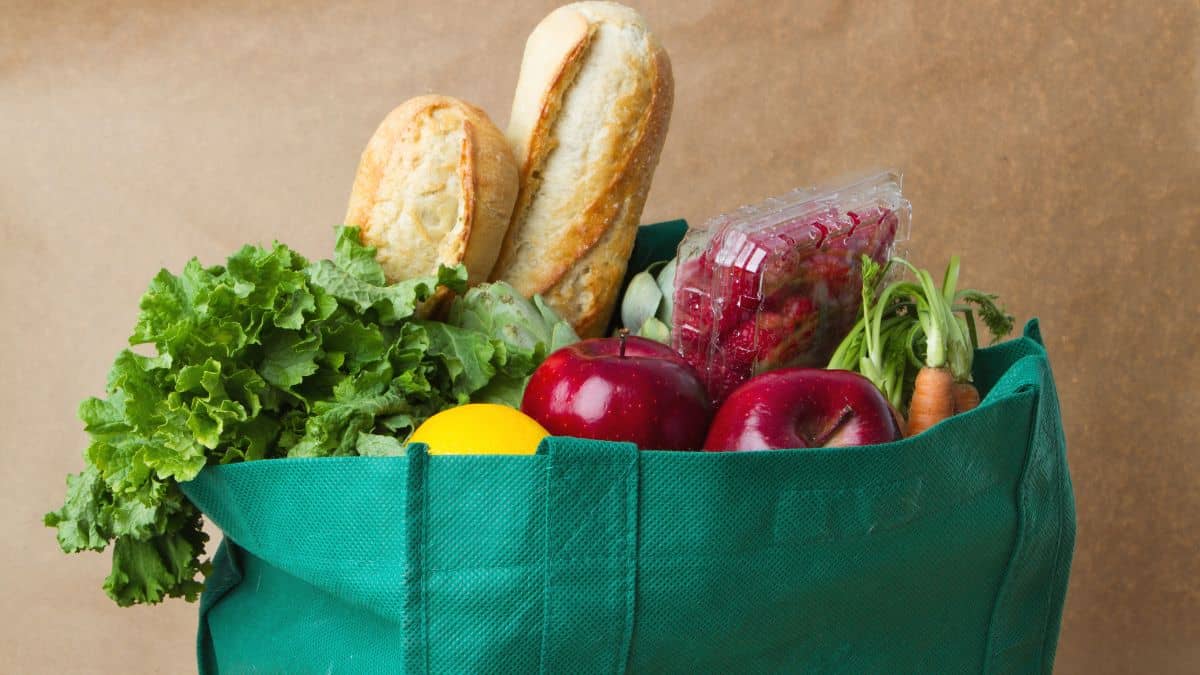 Reusable shopping bags with groceries.