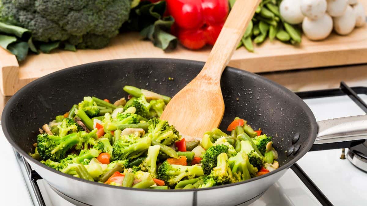 Vegetables sauted in a pan.