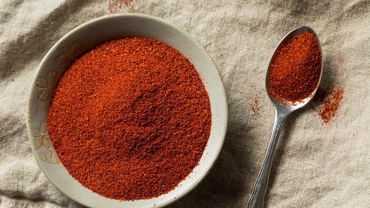 Smoked paprika in a bowl and spoon.