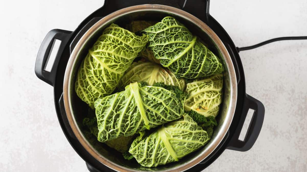 Instant Pot with cabbage rolls inside.