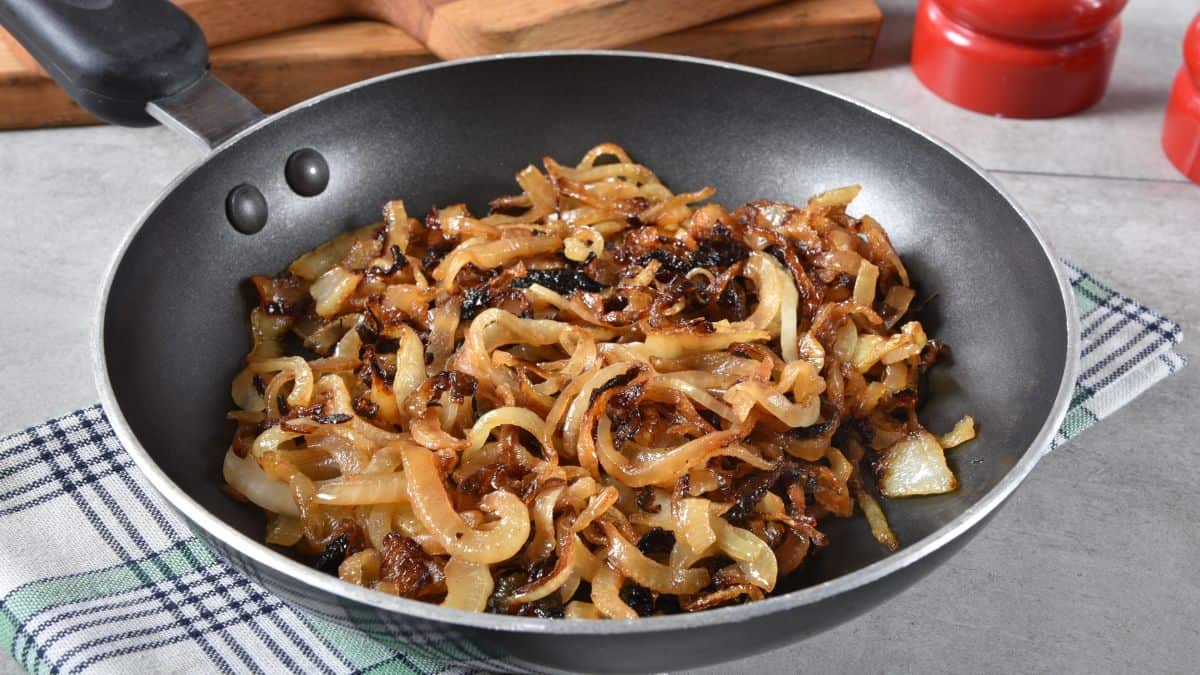 Caramalized onions in a frying pan.