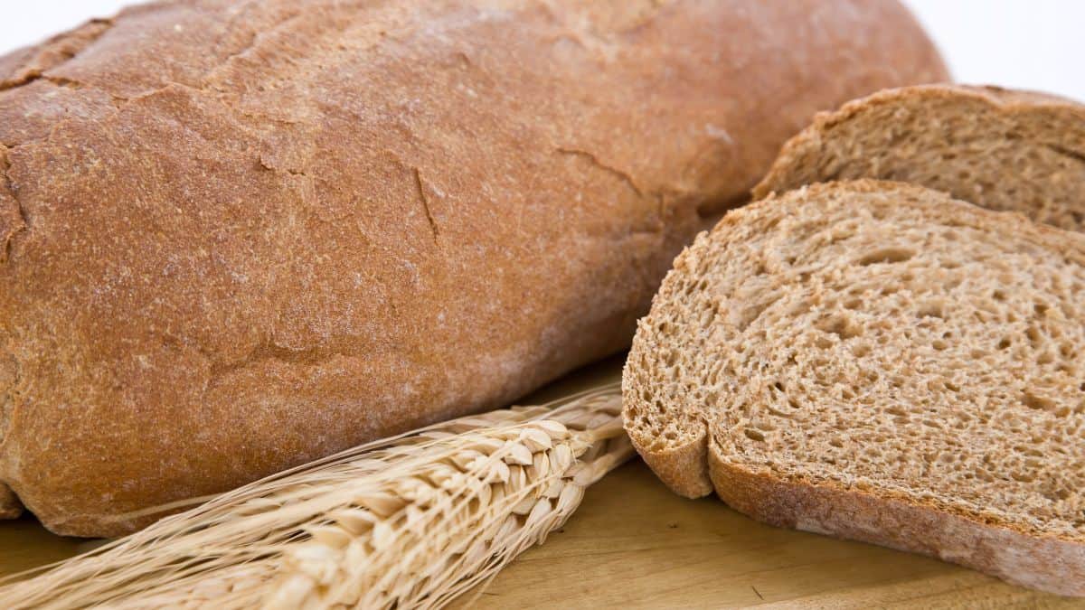 Sliced whole wheat bread on a cutting board.