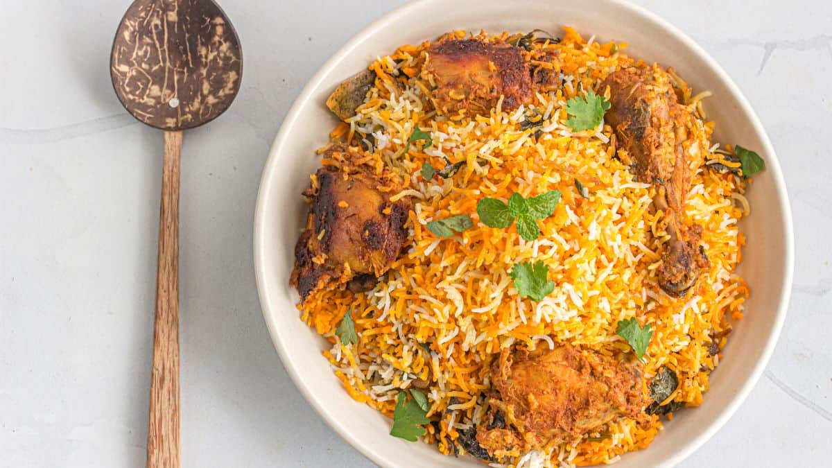 A big plate of biryani on the table.