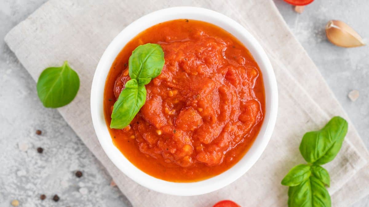 Marinara sauce in a white bowl.